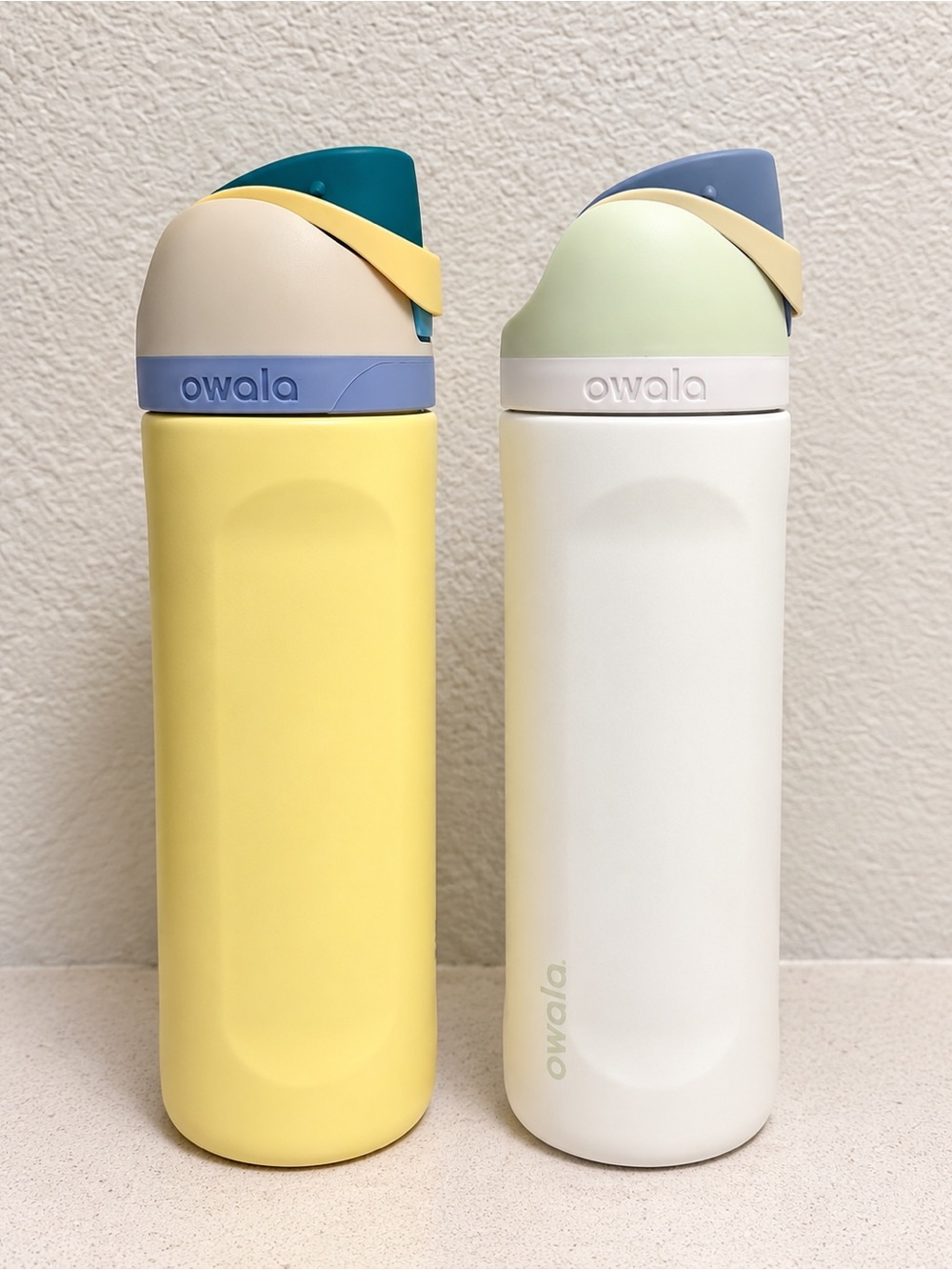 Two 24oz Owala FreeSip Stainless Steel Water Bottles - Yellow and White